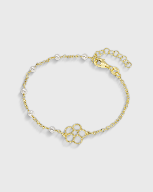 Vogue bracelet with white pearls and a central fllower-shaped motuf